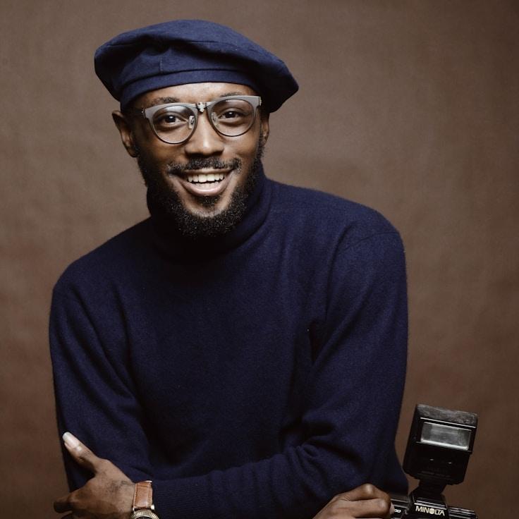 Aria Chen, Lead Design Curator at Neuroquanta Funds, reviewing corporate floral arrangements